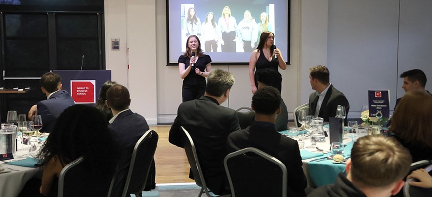Students presenting at an awards ceremony
